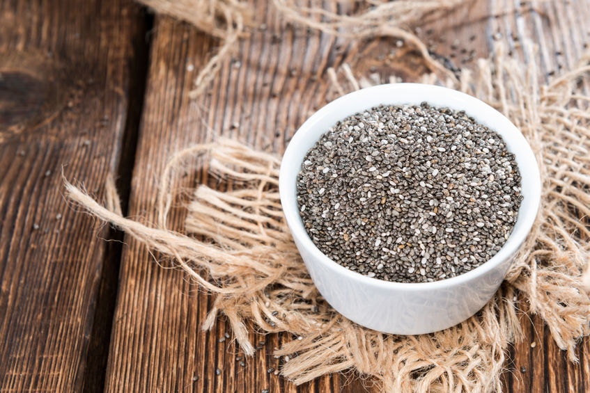 26703894 - chia seeds in a small bowl (on dark wooden background)