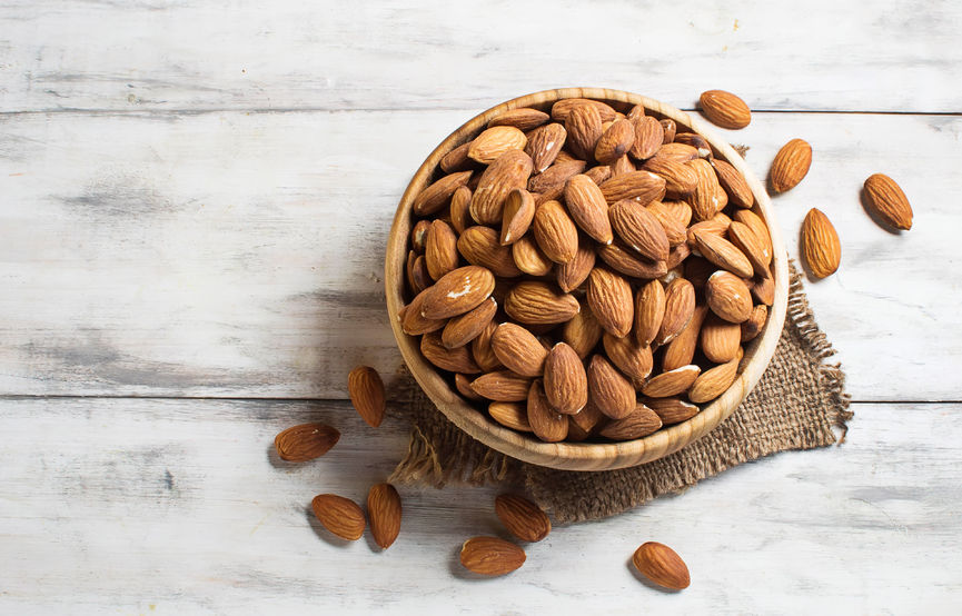 37041638 - almonds in brown bowl on wooden background