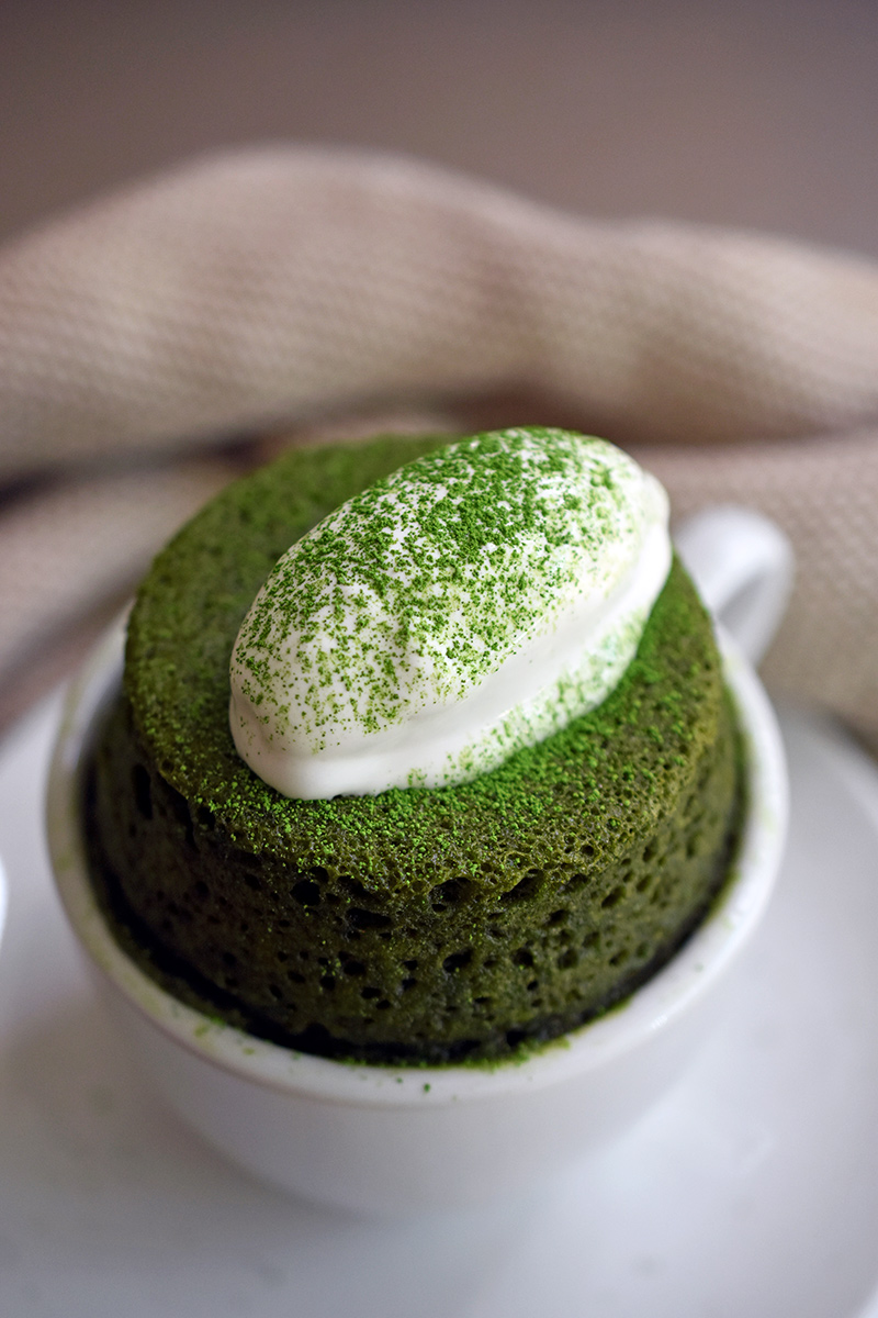 matcha cake in white mug