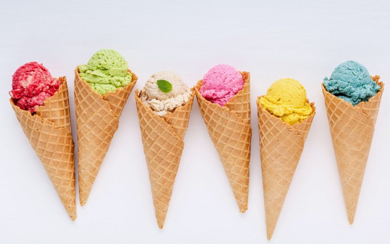 colorful ice cream waffle cones on white background