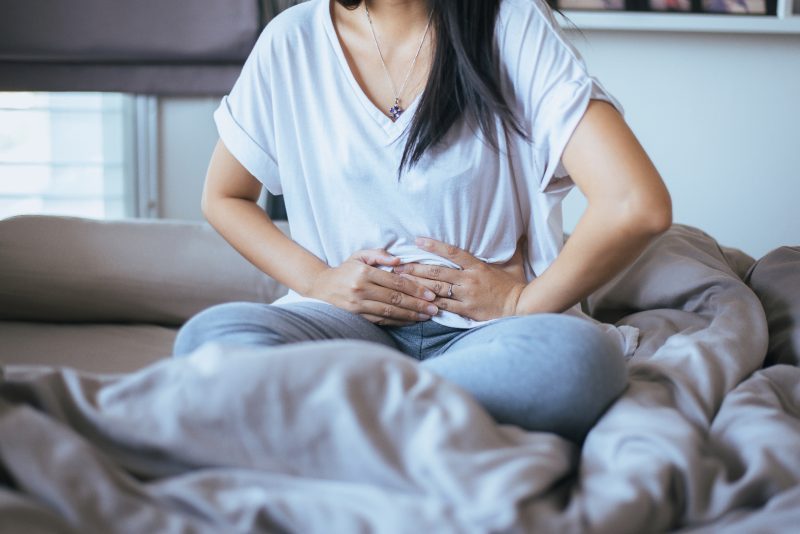 Woman nausea from overeating