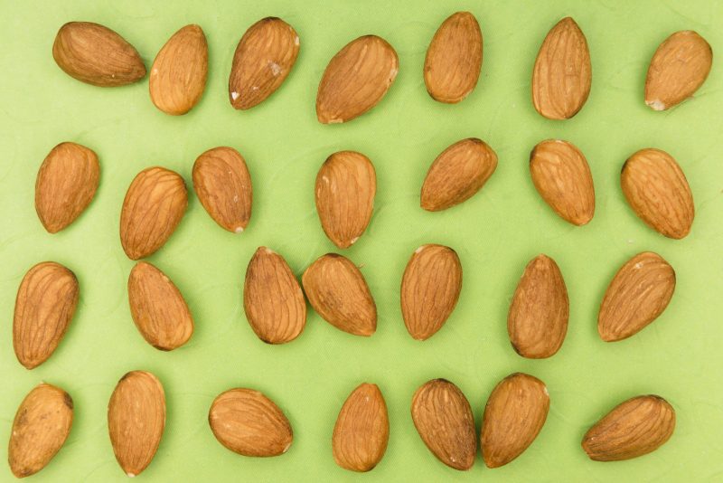 almonds on a green background