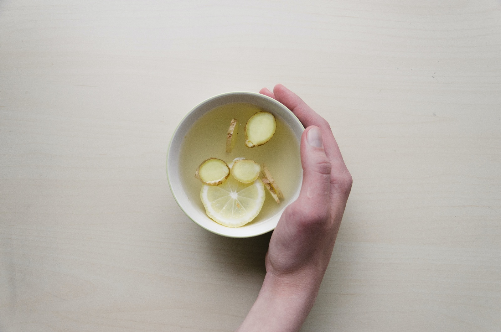 remedies for bloating ginger tea in a white mug