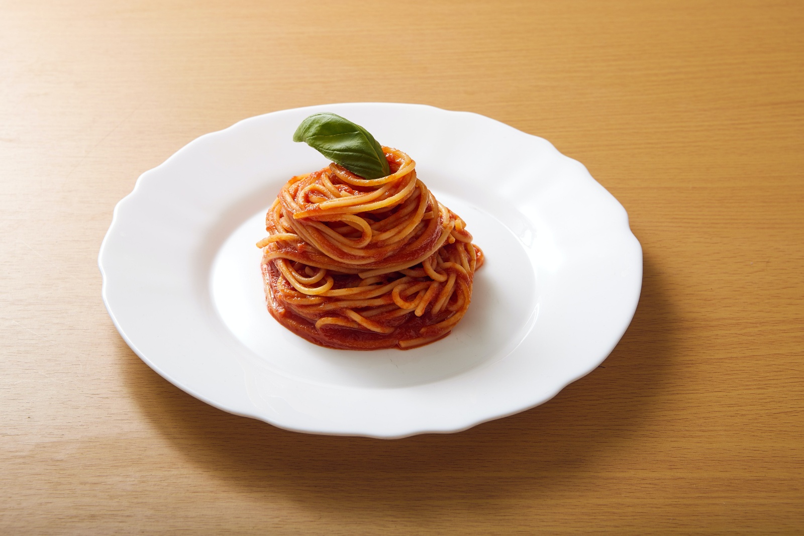 spaghetti on white plate carb cycling blogilates dear cassey