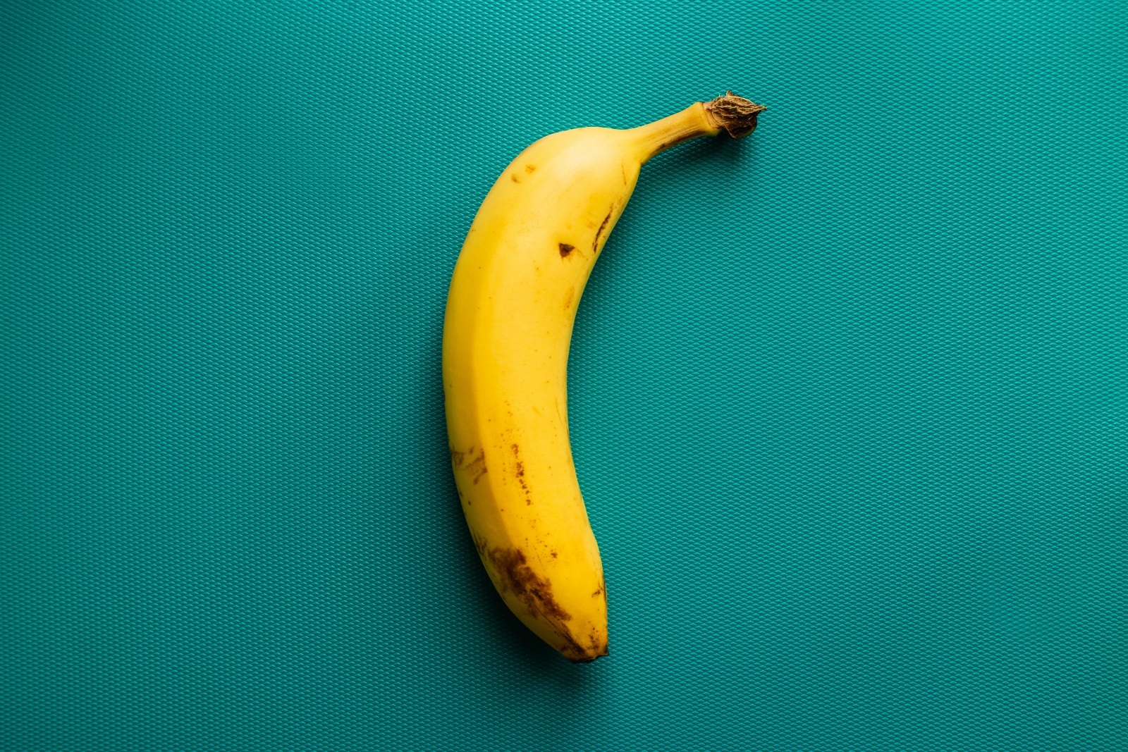 ripe banana on tea background