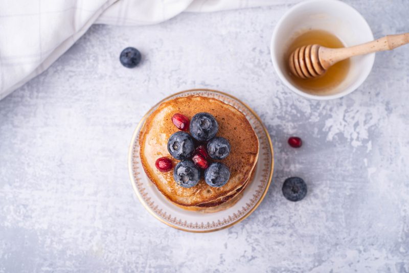 blogilates 90 day journey stack of two ingredient banana pancakes topped with fresh berries