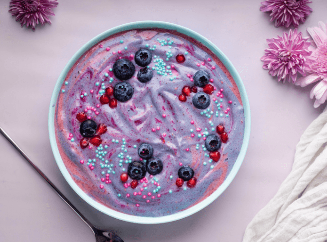 purple and pink swirled unicorn smoothie bowl with berries blogilates 90 day journey recipe
