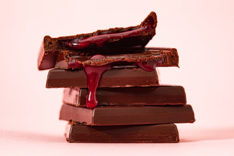 stack of chocolate bars with raspberry filling