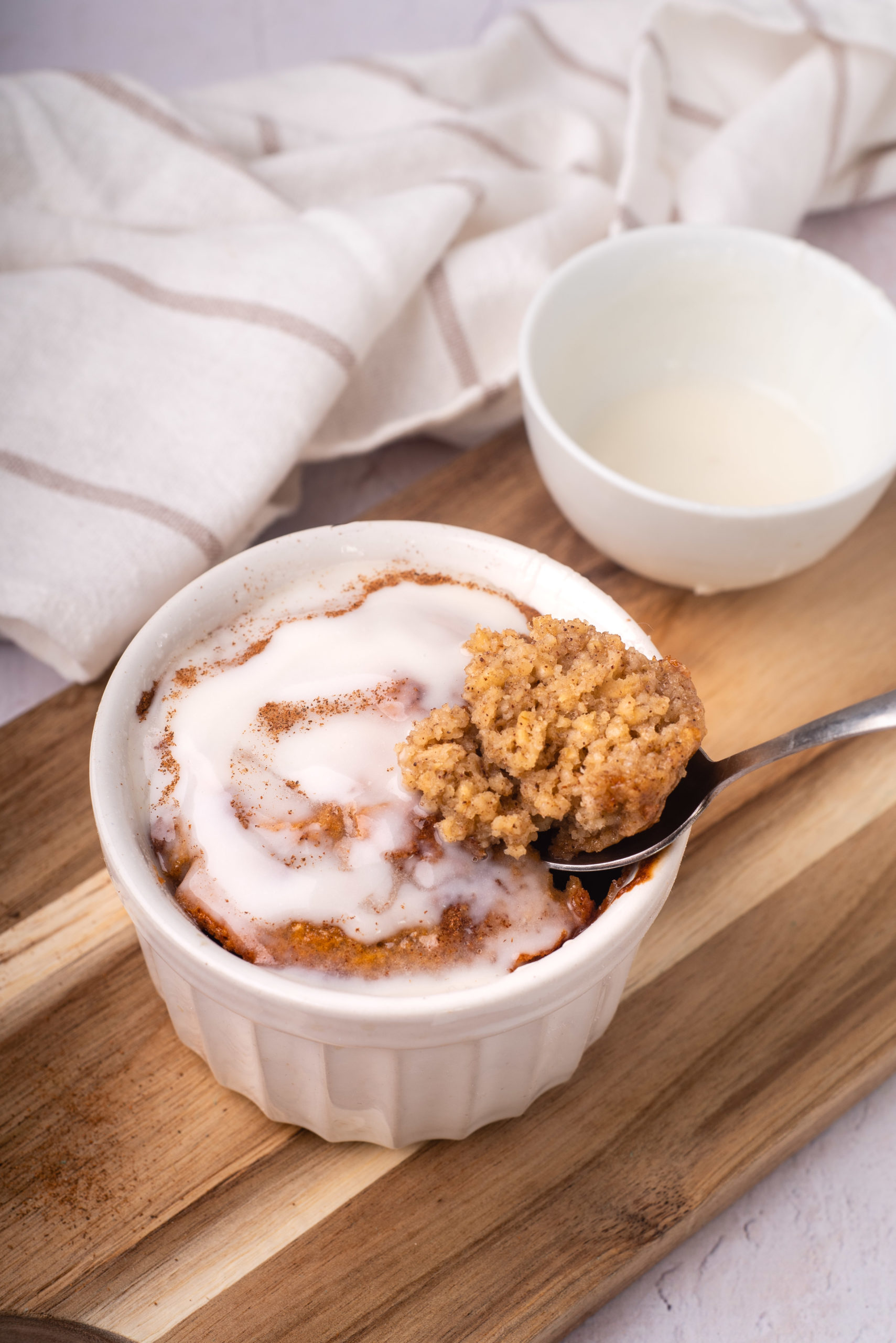 cinnamon roll baked oats with spoon showing bite top 10 breakfast recipes