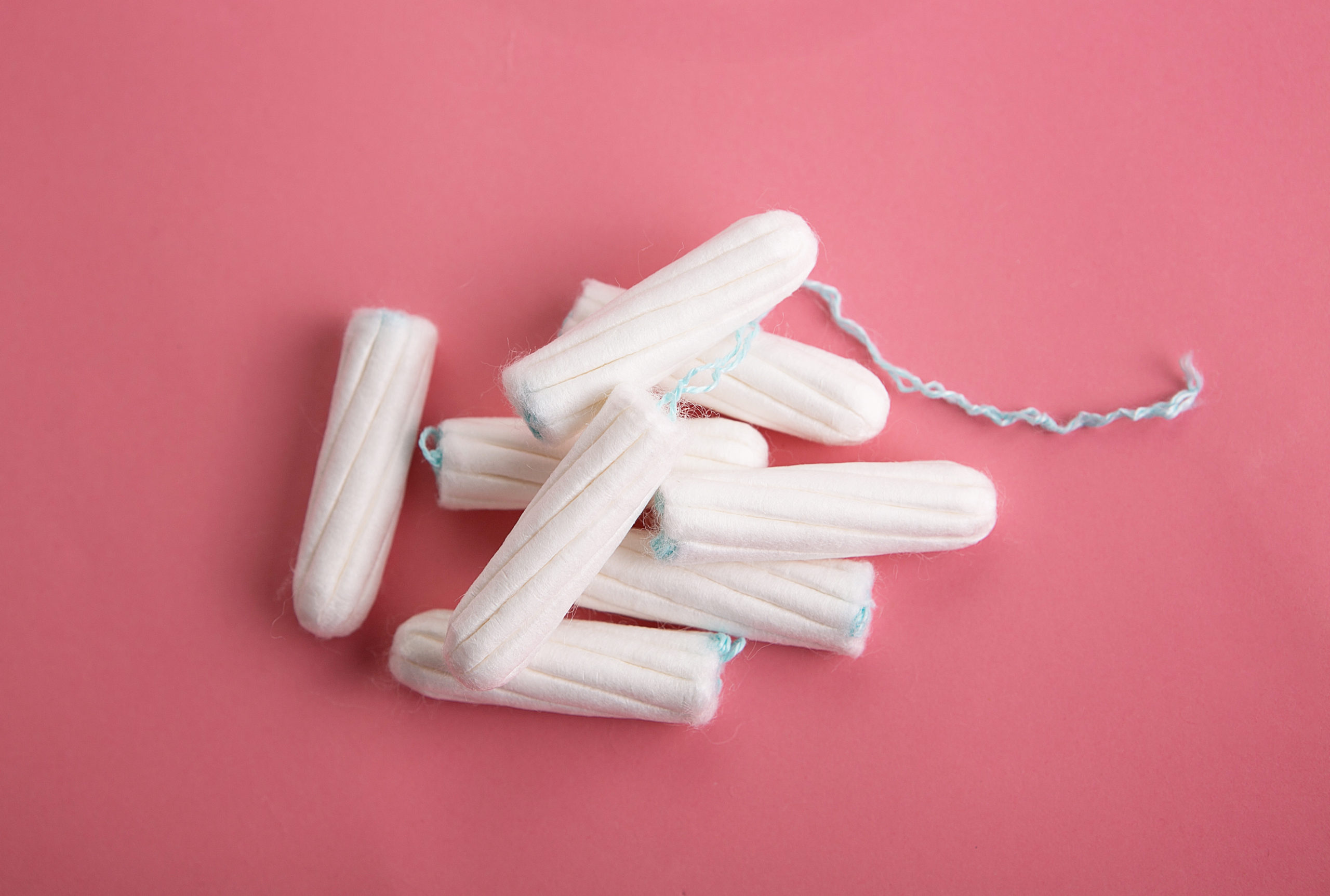 tampons on pink background your period health