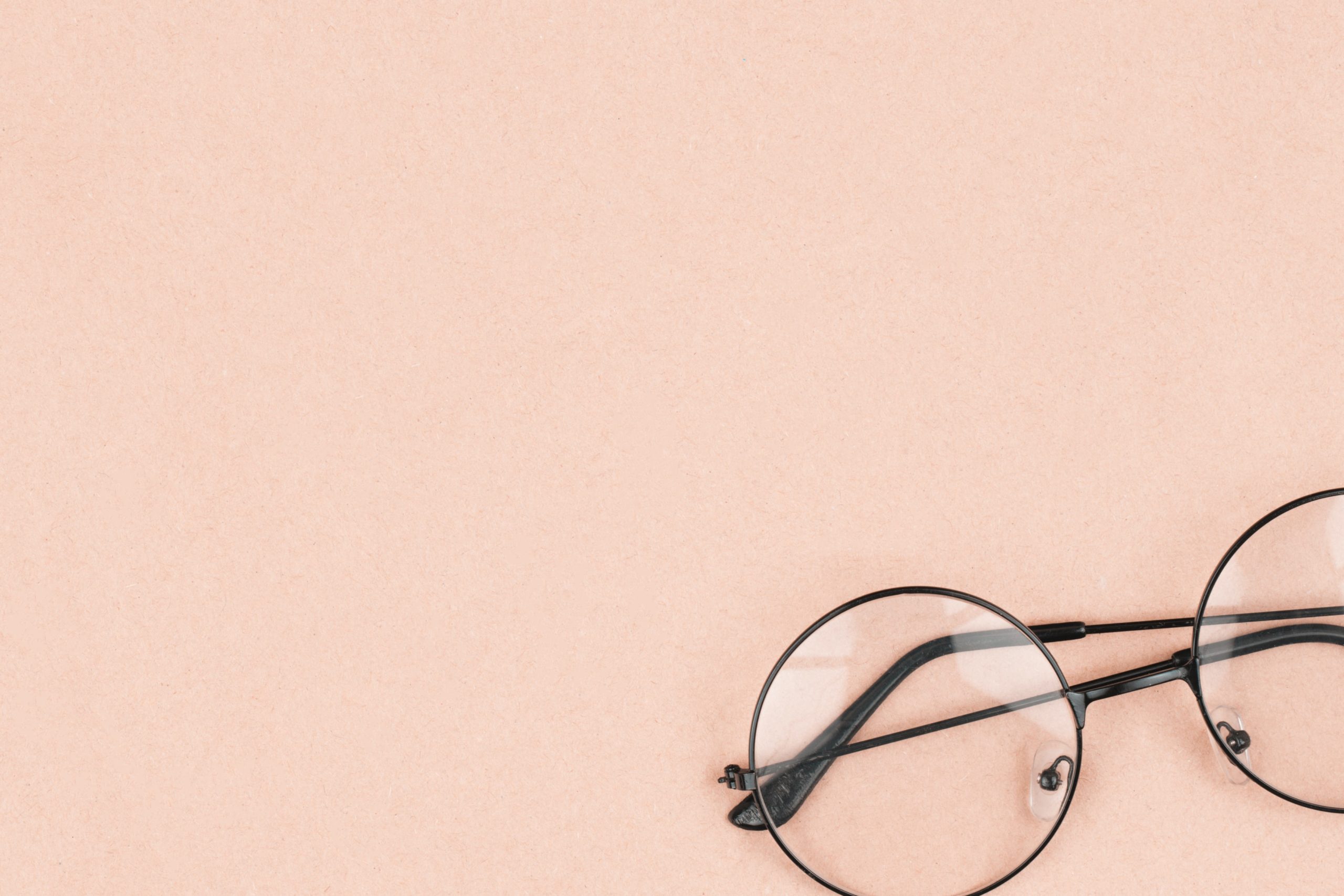 vintage glasses on pink background