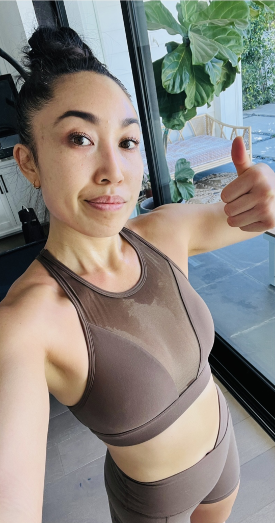 cassey ho sweaty selfie post workout thumbs up wearing popflex basics alpine bra mocha