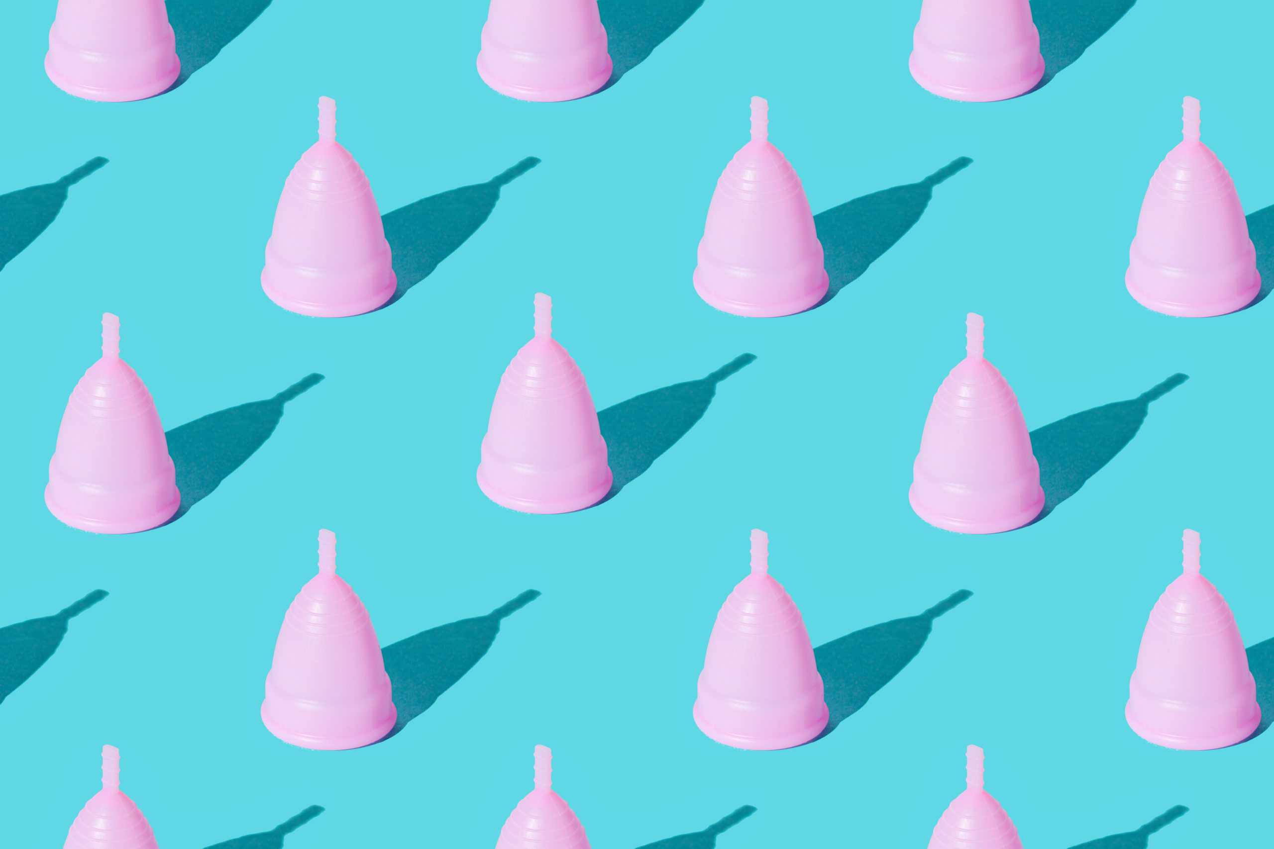 menstrual cup pink pattern on teal background