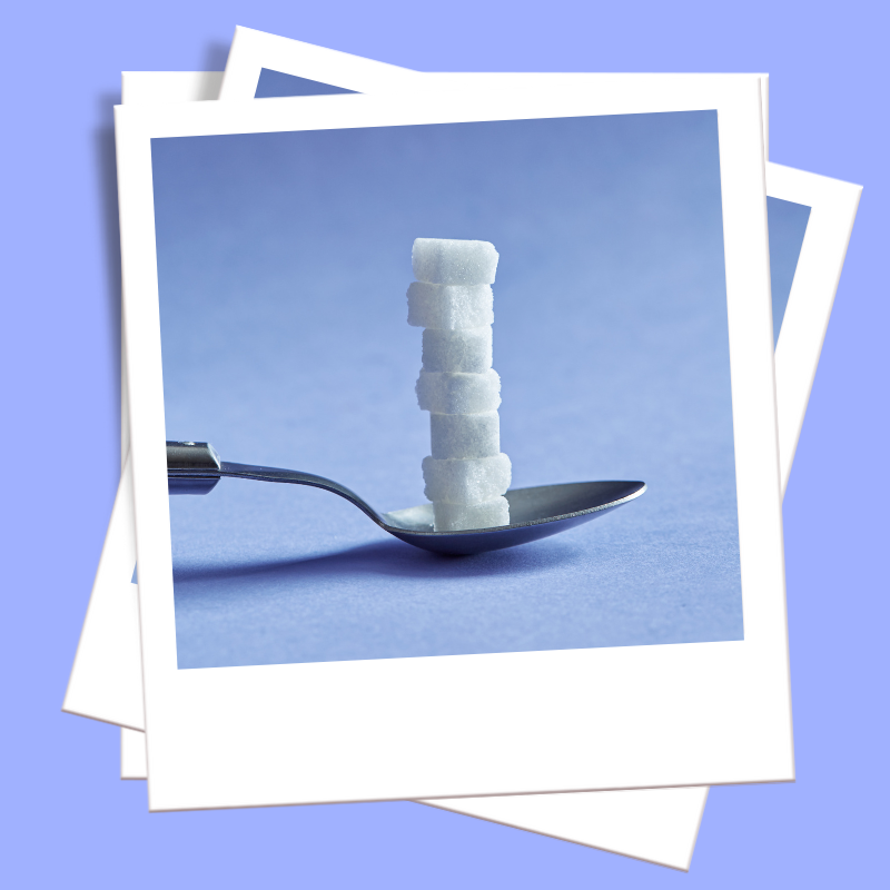 sugar detox polaroid sugar cubes stacked on a spoon