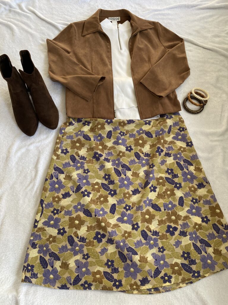 70s fashion daisy jones & the six inspired brown floral skirt, suede jacket, boots