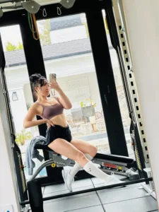 Cassey Ho in the gym wearing Cadence Run Shorts by POPFLEX