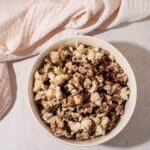 Bowl of protein popcorn made with chocolate protein powder blogilates