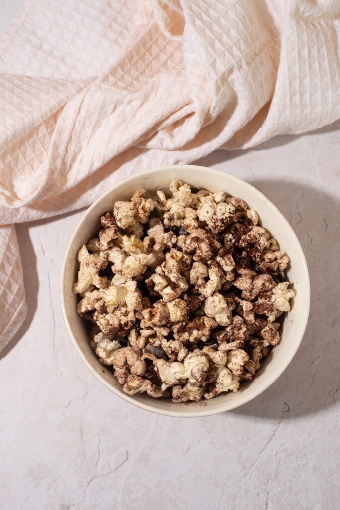 Bowl of protein popcorn made with chocolate protein powder blogilates