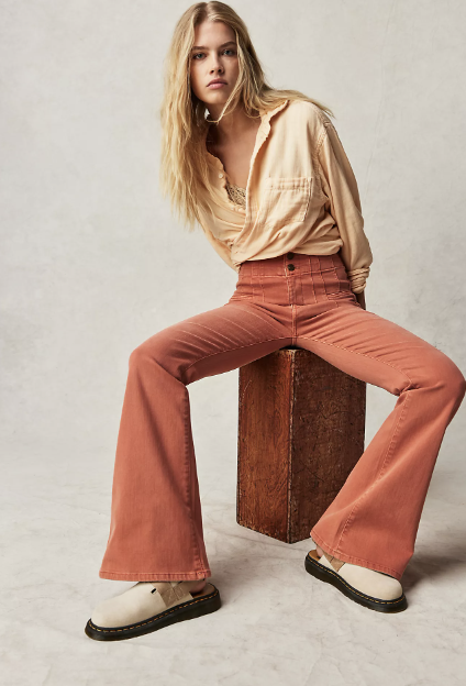 free people daisy jones and the six 70s fashion orange flared jeans