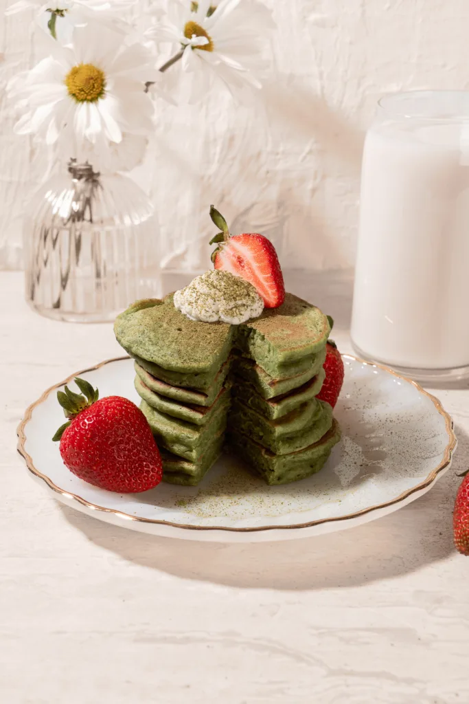 stack of matcha mochi pancakes with strawberries