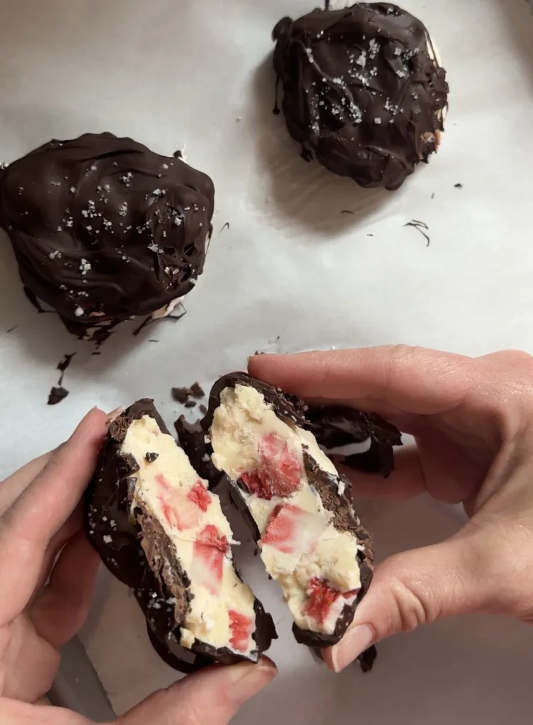 cut open view of chocolate covered strawberry frozen yogurt bites