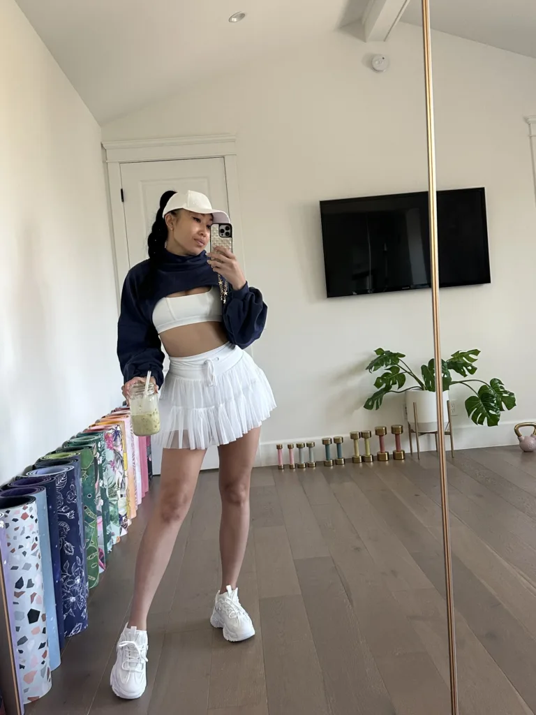 cassey ho wearing popflex pirouette skort white