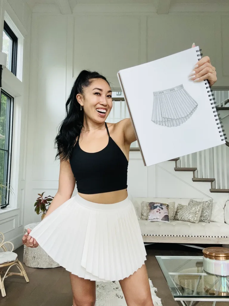 cassey ho wearing popflex ace em pleated skort