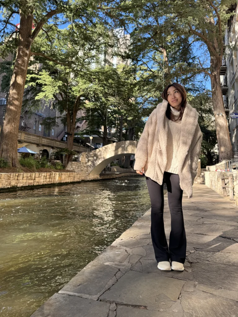 cassey ho blogilates wearing popflex cocoon coat and flared leggings riverwalk